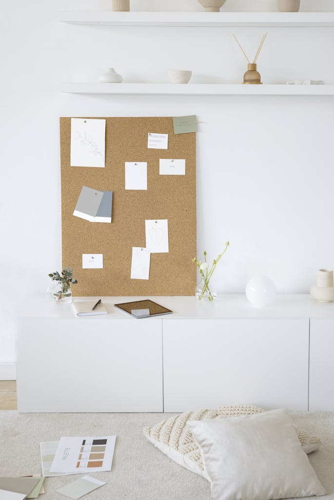 bright and modern minimalist workspace with cork board for inspiration and creativity. 7552453 685x1024.jpg